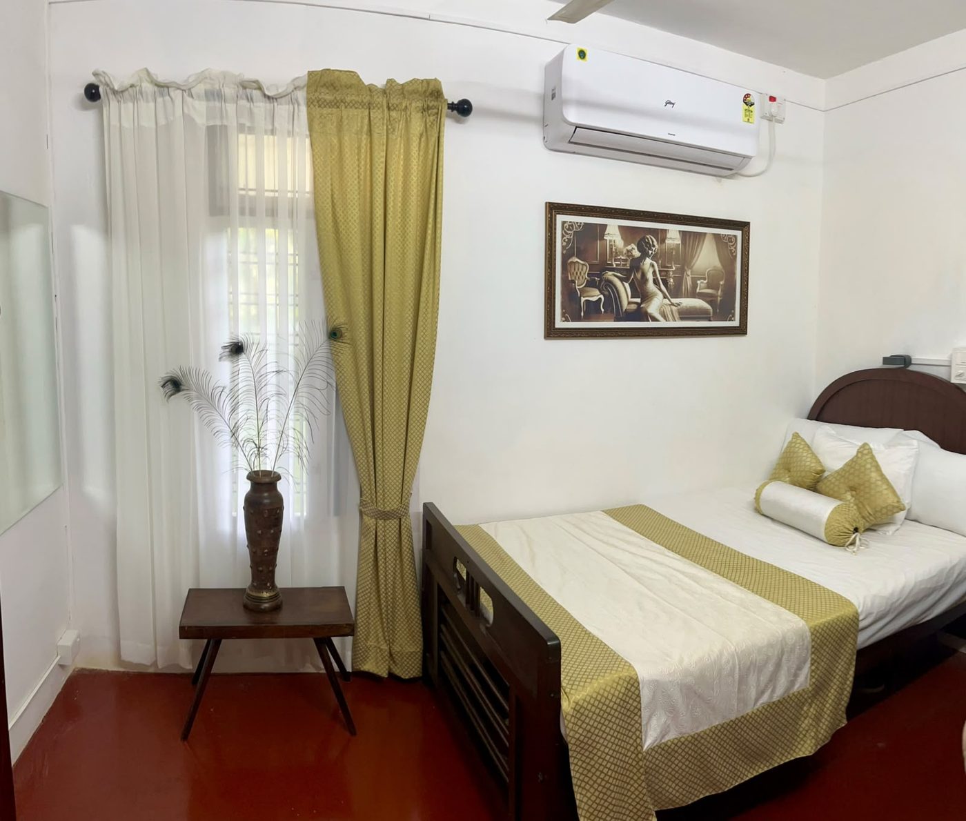 The Classic Room, with peacock feather and antique details, at Scarlet's Cottage